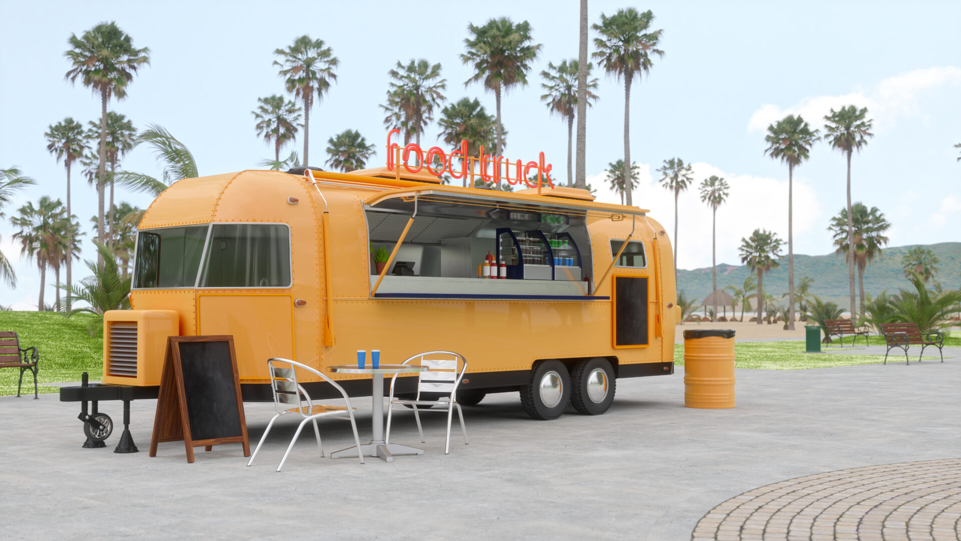 Yellow food truck with outdoor seating