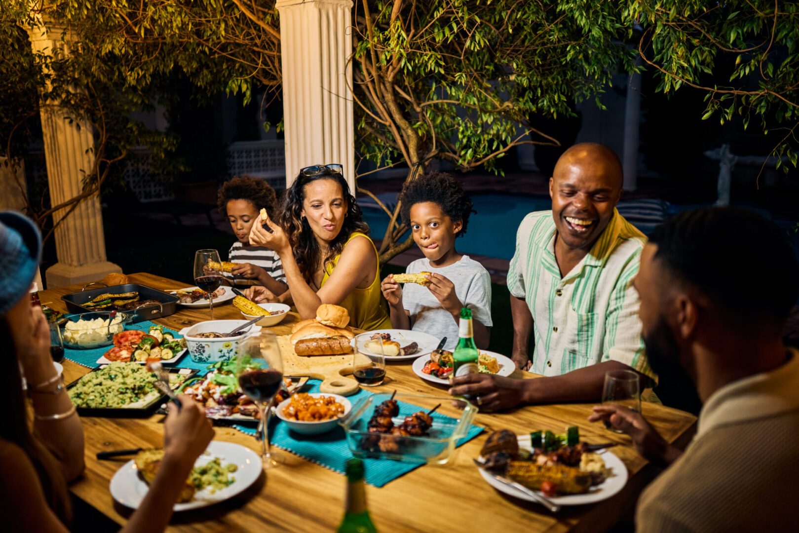 Smiling group dining al fresco