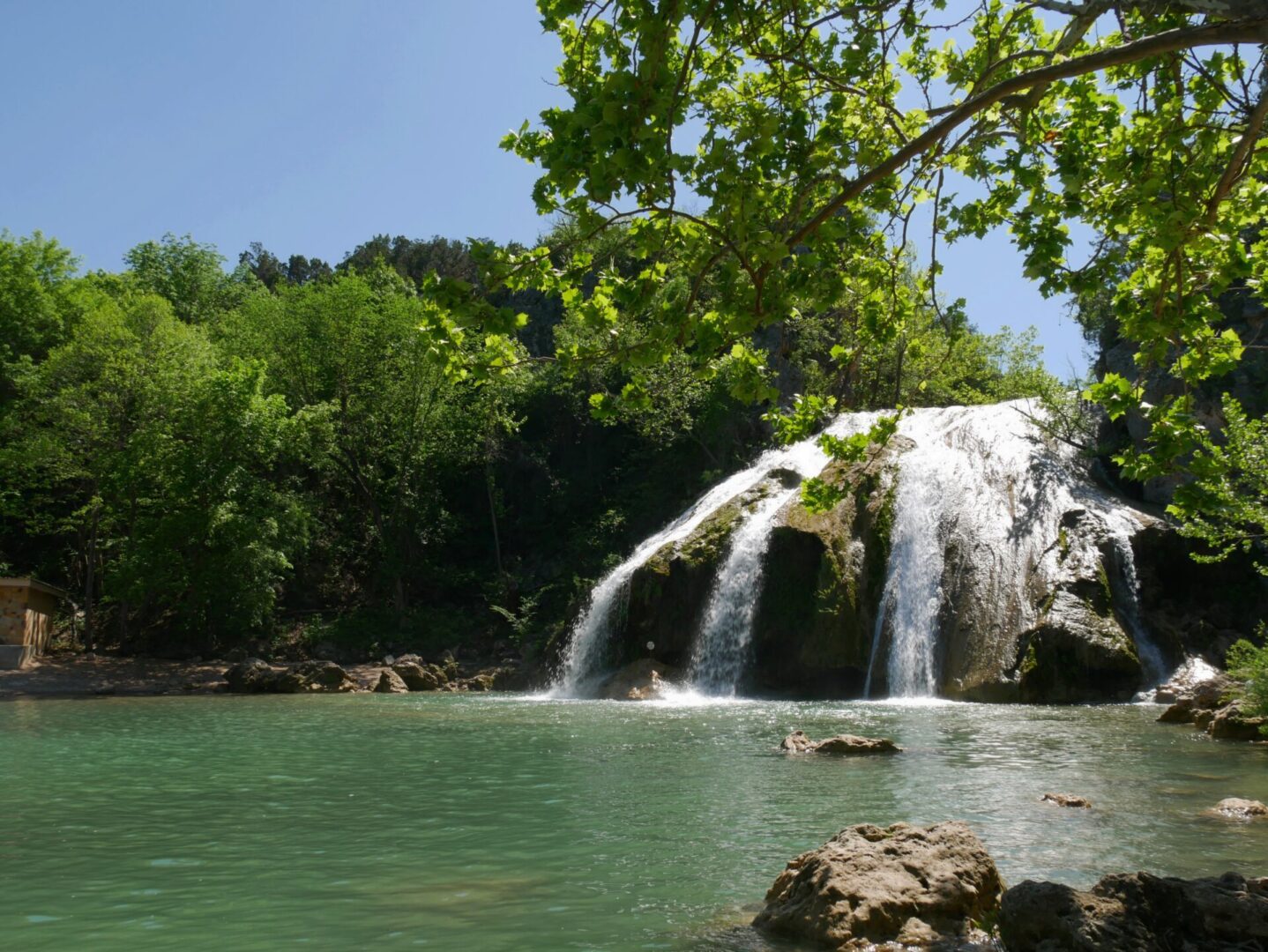 Tranquil waterfall with clear pool